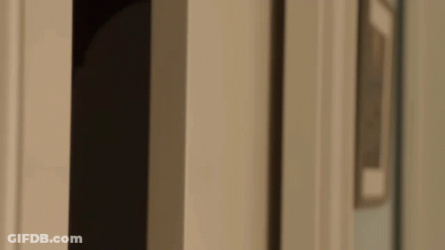 Close Up Of Man Looking Out Doorway GIF