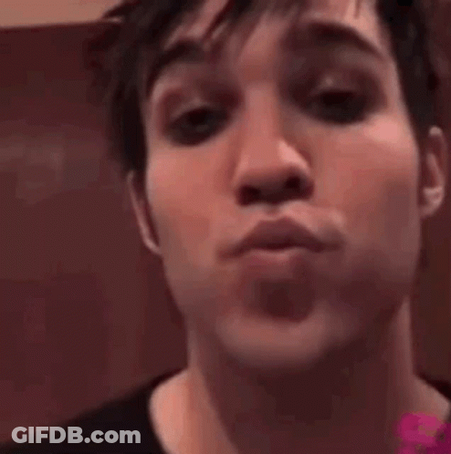 Close Up Of Man Making A Kiss GIF