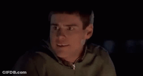 Close Up Of Man Making Funny Face In Dark Room GIF