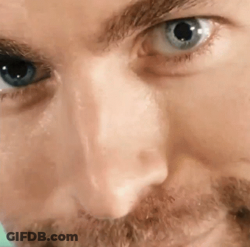 Close Up Of Man's Blue Eye With Beard GIF