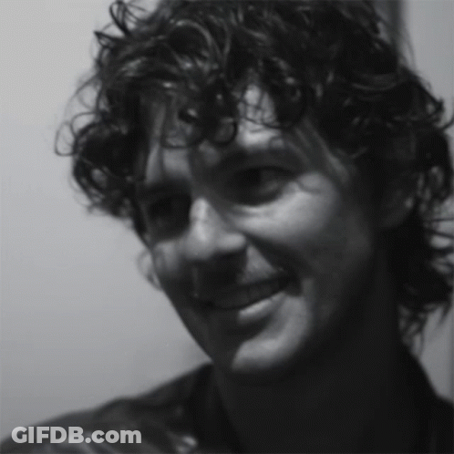 Close Up Of Man's Curly Hair Face GIF