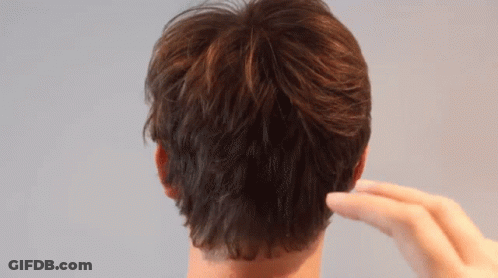 Close Up Of Man's Ear And Hand GIF
