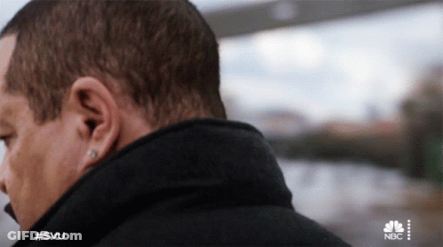 Close Up Of Man's Ear With NBC Logo GIF