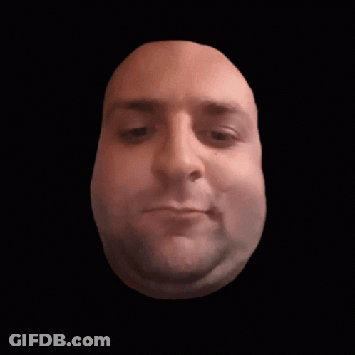 Close Up Of Man's Face Against Black Backdrop GIF