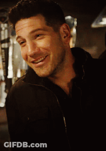 Close Up Of Man's Face In Black Jacket GIF