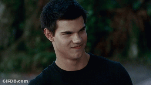 Close Up Of Man's Face In Black Shirt GIF