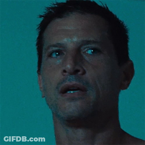 Close Up Of Man's Face In Dark GIF