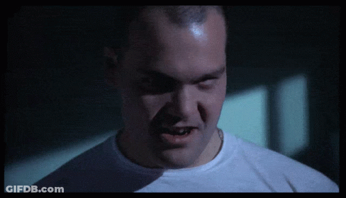 Close Up Of Man's Face In Dark Room GIF