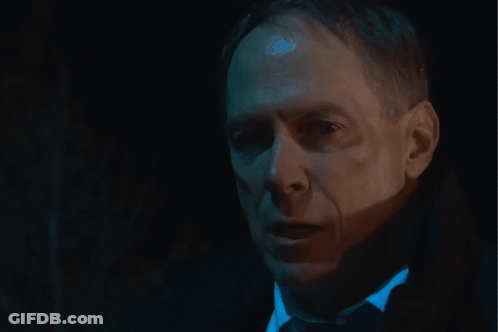 Close Up Of Man's Face In Dark Room GIF