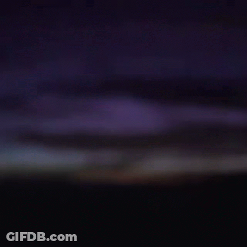 Close Up Of Man's Face In Darkness GIF