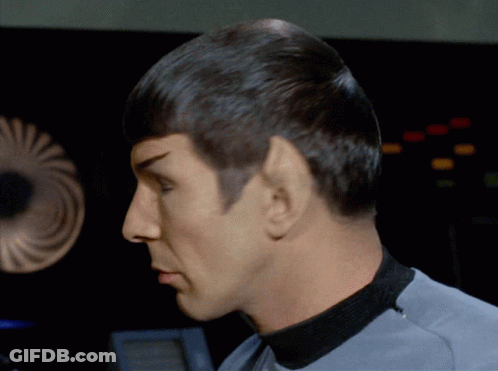 Close Up Of Man's Face In Gray Shirt GIF