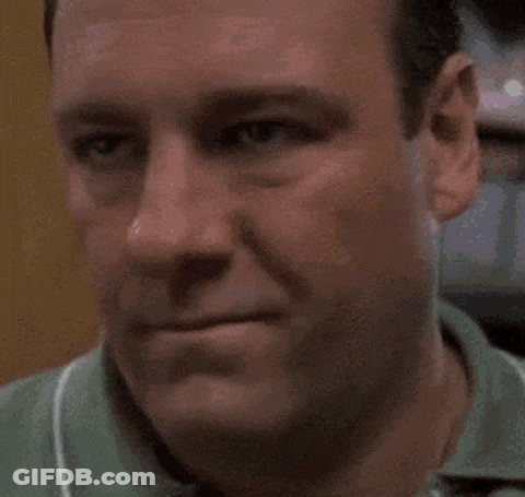 Close Up Of Man's Face In Green Shirt GIF