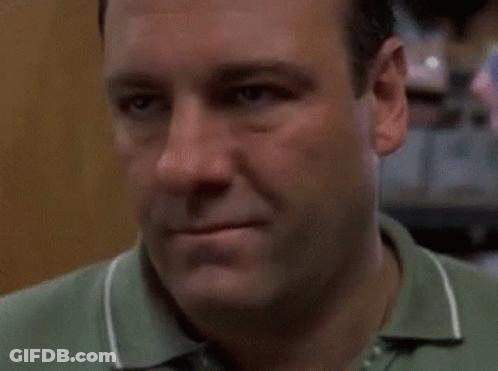 Close Up Of Man's Face In Green Shirt GIF