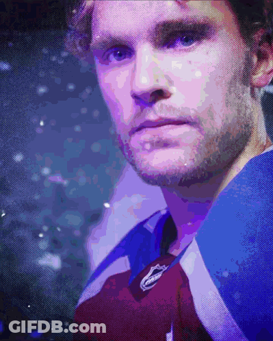 Close Up Of Man's Face In Purple And Blue Jersey GIF