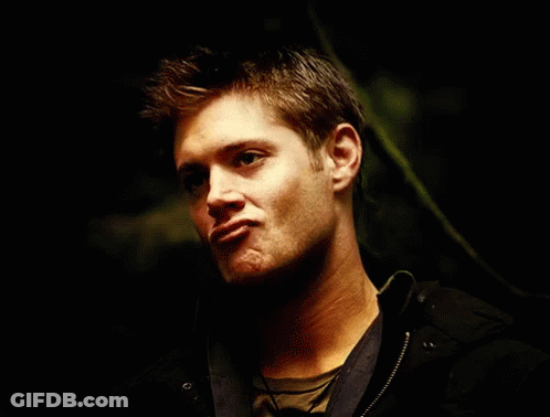 Close Up Of Man's Face In The Dark GIF