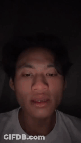 Close Up Of Man's Face In White Shirt GIF