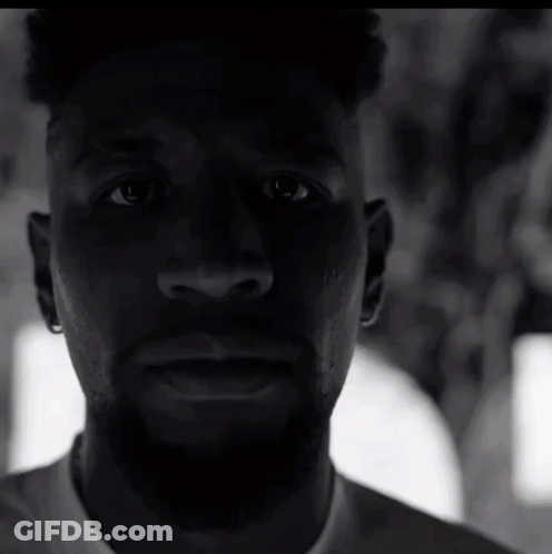 Close Up Of Man's Face In White Shirt GIF