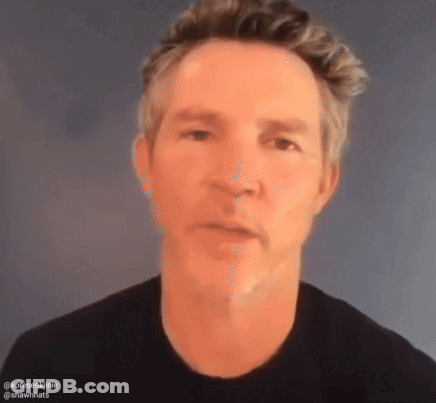 Close Up Of Man's Face On Gray Background GIF