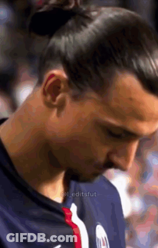 Close Up Of Man's Face With A Bun GIF