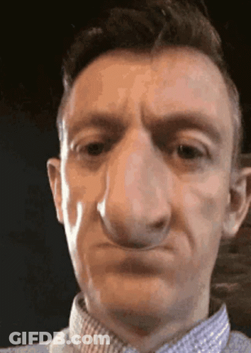 Close Up Of Man's Face With Big Nose GIF