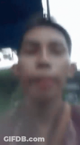 Close Up Of Man's Face With Blurry Background GIF