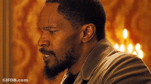 Close Up Of Man's Face With Candles GIF