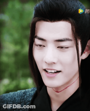 Close Up Of Man's Face With Chinese Writing GIF