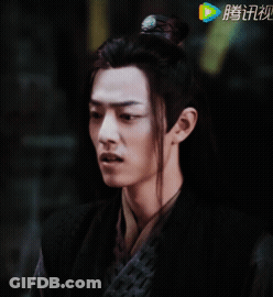 Close Up Of Man's Face With Chinese Writing GIF
