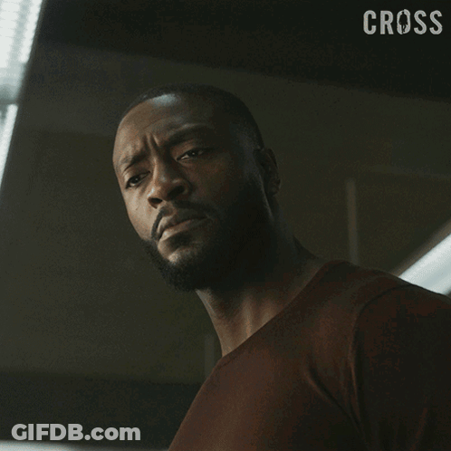 Close Up Of Man's Face With Cross GIF
