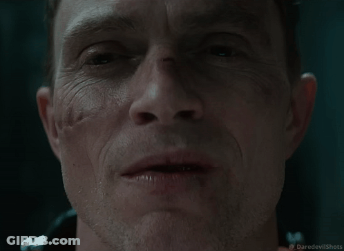 Close Up Of Man's Face With Daredevil Shots Logo GIF