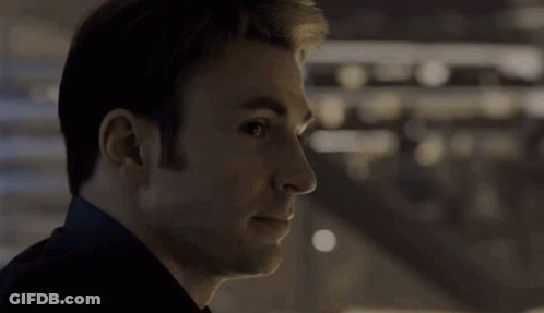 Close Up Of Man's Face With Dark Background GIF