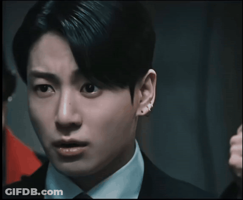 Close Up Of Man's Face With Ear Piercing GIF