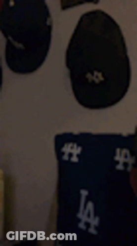 Close Up Of Man's Face With La Hat GIF