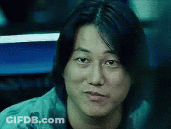 Close Up Of Man's Face With Long Black Hair GIF