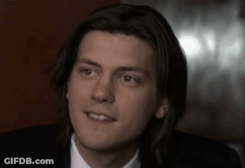 Close Up Of Man's Face With Long Hair GIF