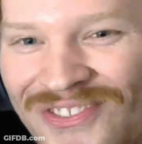 Close Up Of Man's Face With Mustache And Teeth GIF