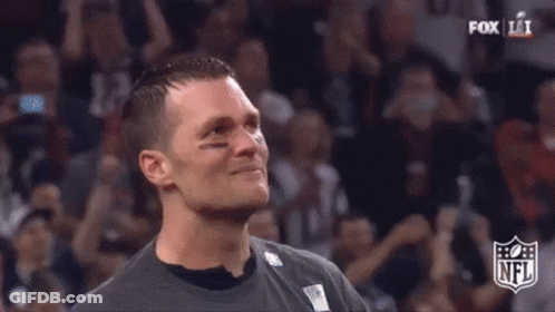 Close Up Of Man's Face With NFL Logo In Background GIF