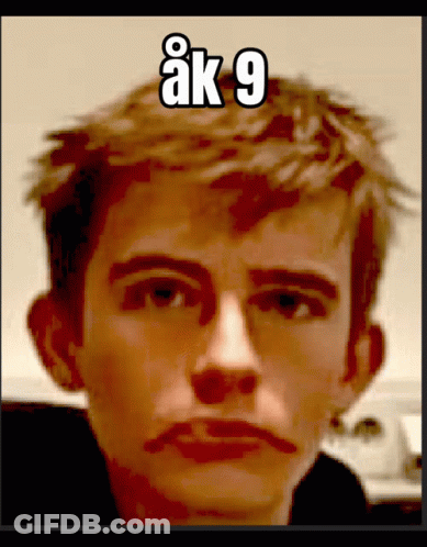 Close Up Of Man's Face With Number 9 GIF