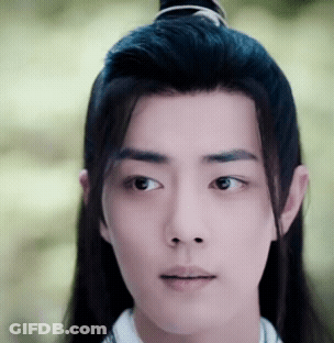 Close Up Of Man's Face With Ponytail GIF