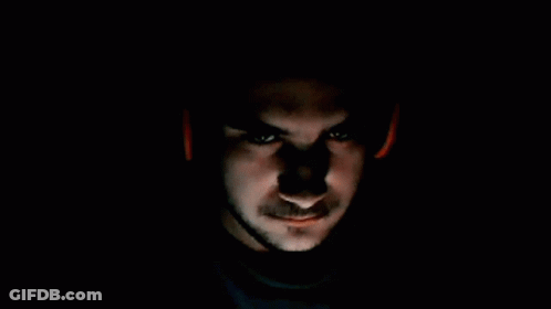 Close Up Of Man's Face With Red Light GIF