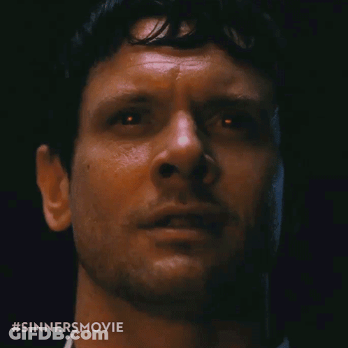 Close Up Of Man's Face With Sinners Movie Hashtag GIF