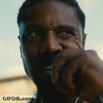 Close Up Of Man's Face With Sinners Movie Hashtag GIF