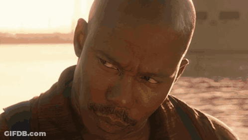 Close Up Of Man's Face With Sun Behind GIF