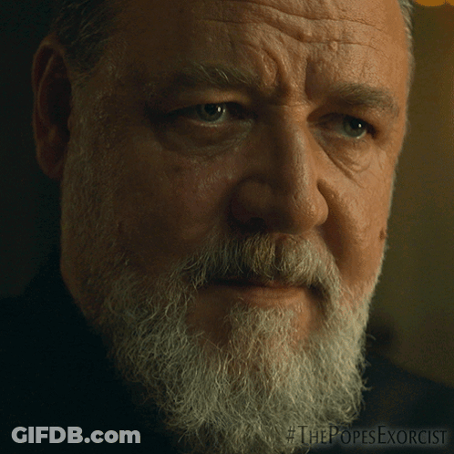 Close Up Of Man's Face With The Popes Exorcist GIF