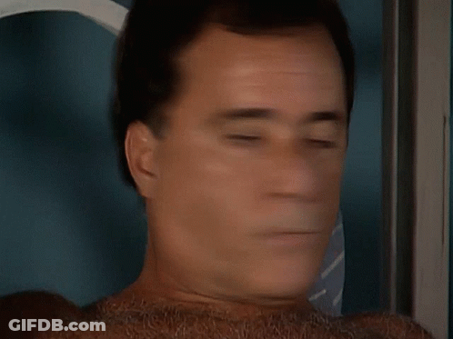 Close Up Of Man's Face With Tie GIF