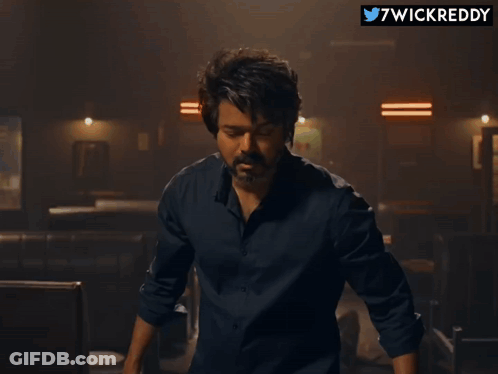 Close Up Of Man's Face With Twitter Username 7Wickreddy GIF