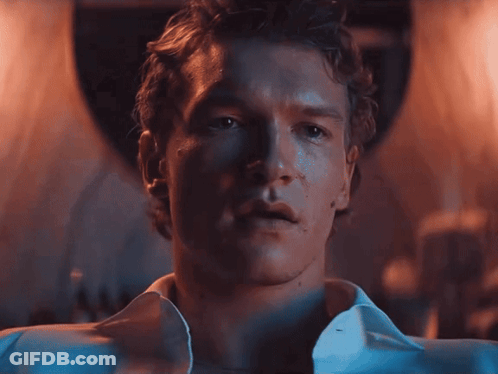 Close Up Of Man's Face With White Shirt Open GIF
