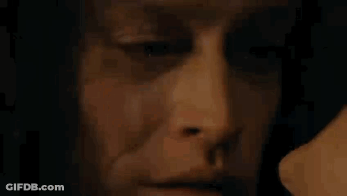 Close Up Of Man's Face With Woman Behind GIF