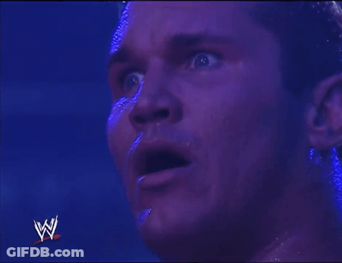 Close Up Of Man's Face With Wrestling Logo GIF