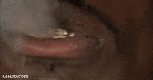 Close Up Of Man's Mouth With Ring Saying I Need Money GIF